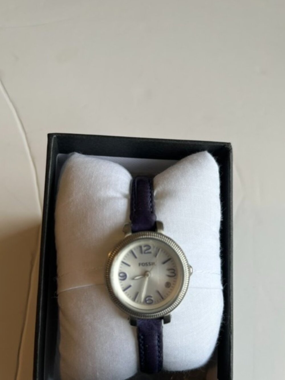 Fossil women’s analog watch.